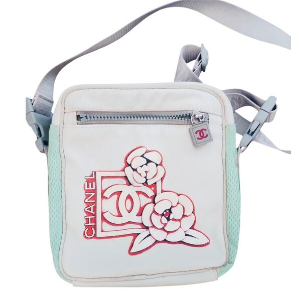 CHANEL Handbags - CHANEL Nylon And Mesh Camelia Floral Crossbody Camera Sport Bag Pink Aqua White